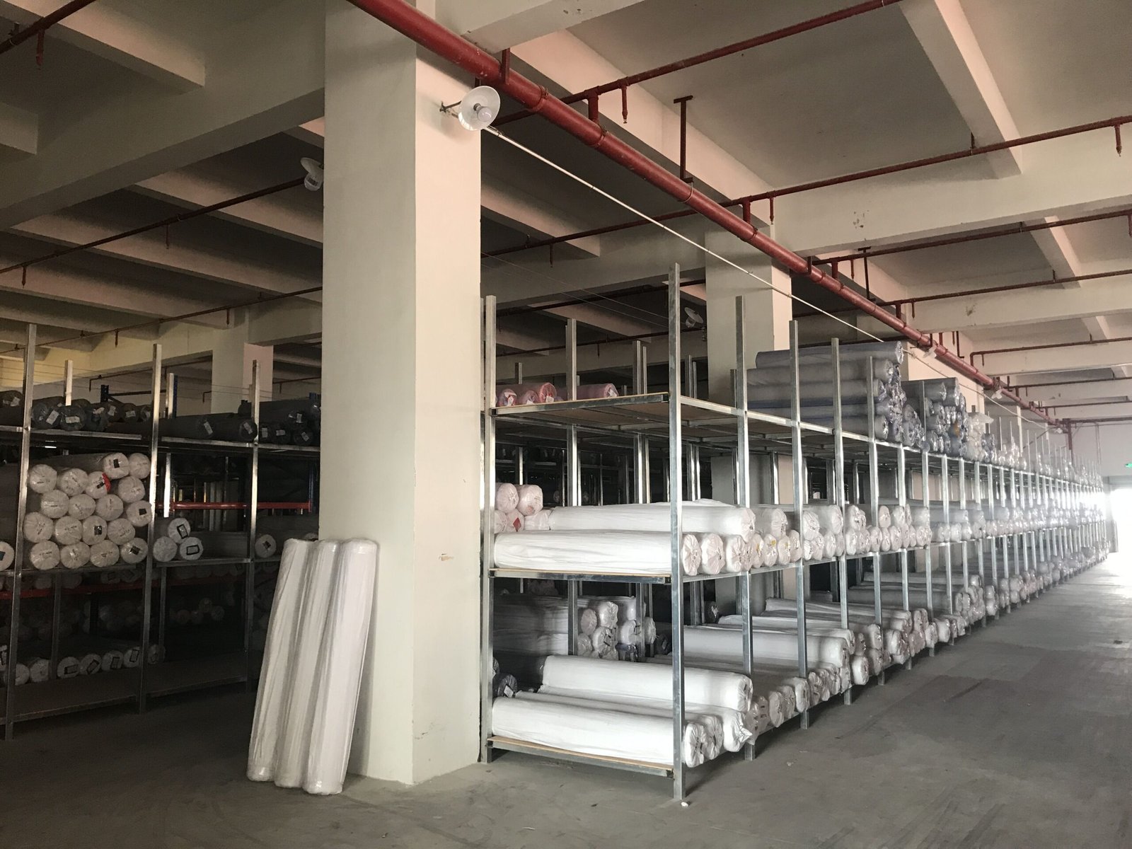 Faux leather rolls in warehouse for upholstery material supply